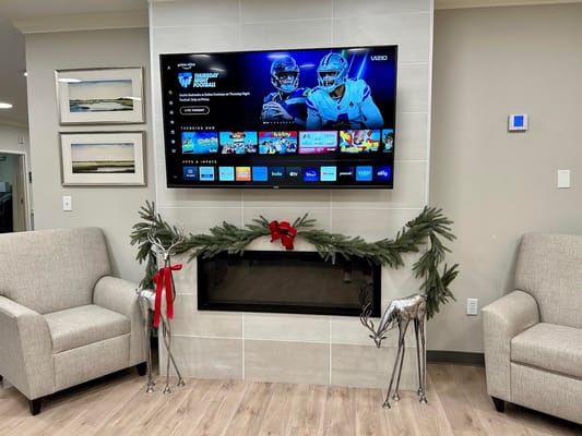 Cozy common area with a TV and holiday decor