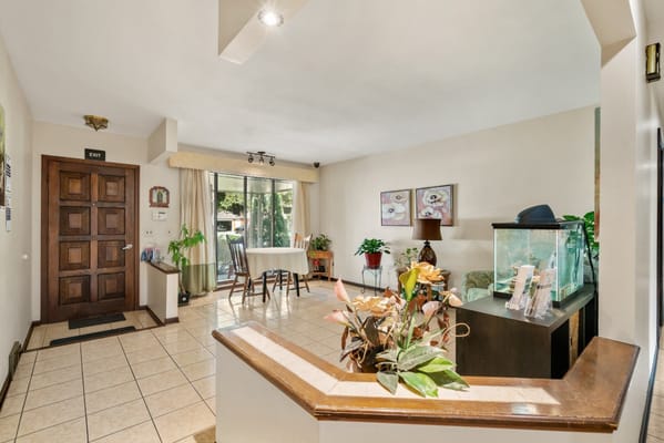 Bright common area with a seating arrangement and plants