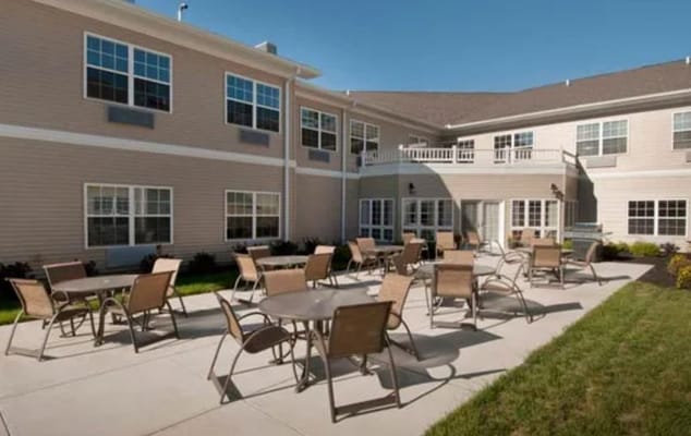 Outdoor seating area with tables and chairs