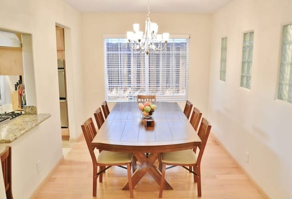 Bright dining area with a large wooden table