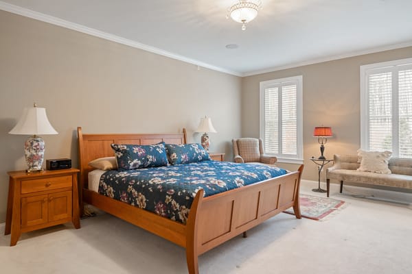 Cozy private bedroom with a floral comforter and decor