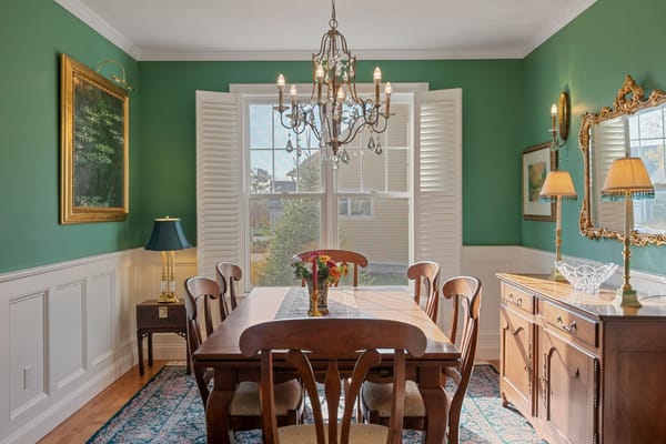 Dining room with wooden table and chandelier