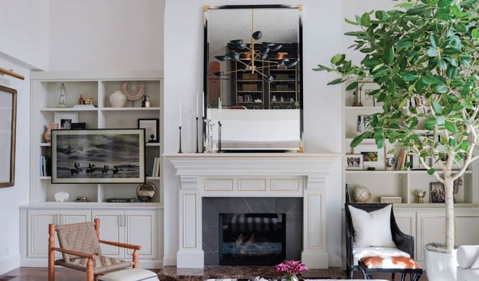 A cozy common area with a fireplace and decor