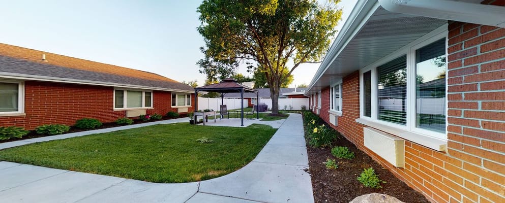 Well-maintained outdoor space with gazebo and greenery