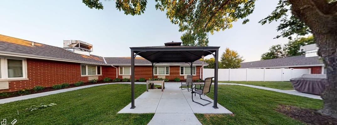 Outdoor space with seating in a landscaped area