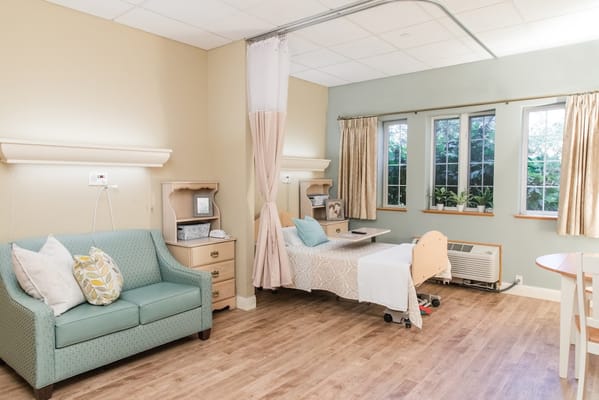 A cozy resident room with natural light