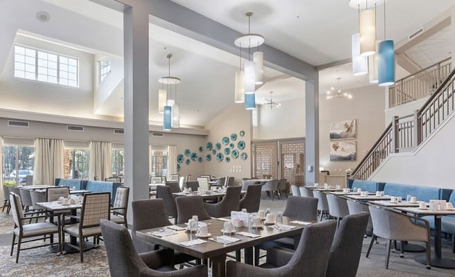 Dining area with tables set for residents