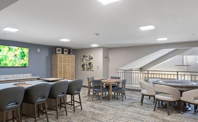 Interior view of a common area with seating and games