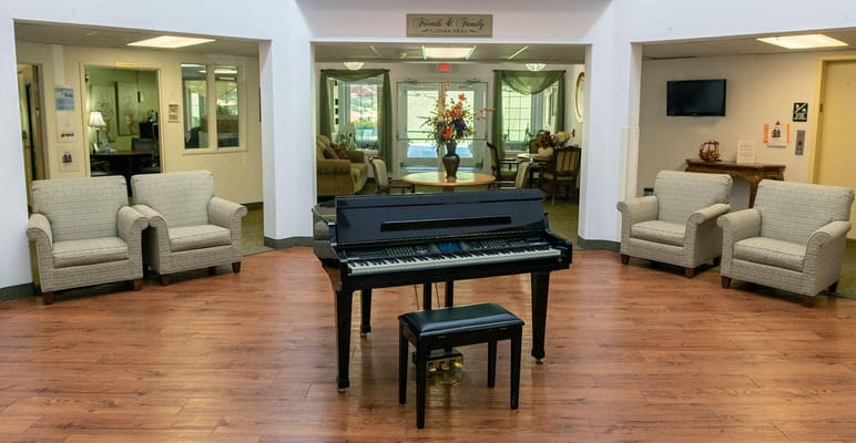 Common area with a piano and seating arrangement