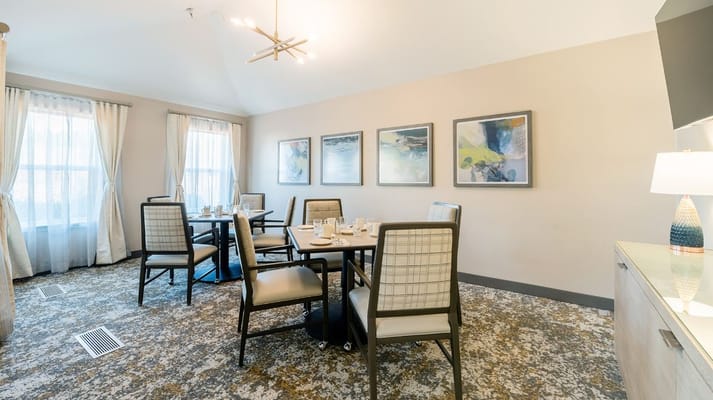 Bright dining room with tables set for a meal