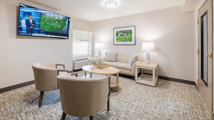 Cozy living area with sofa and TV