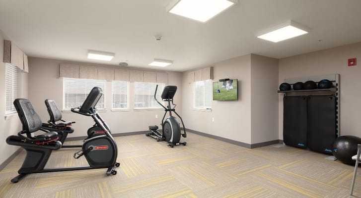Well-equipped fitness room with exercise machines