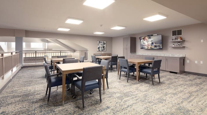 Empty common area with tables and chairs