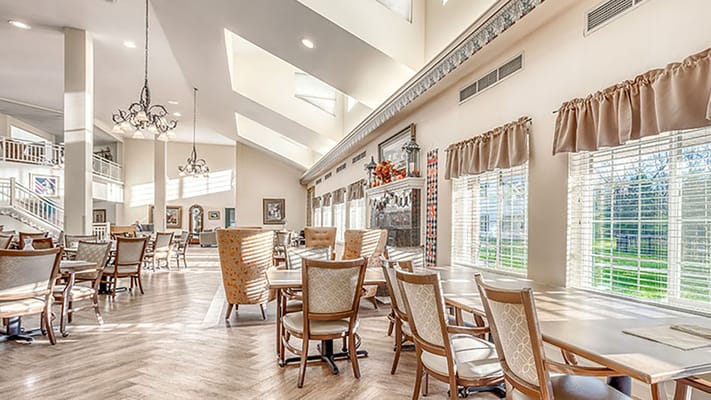 Spacious dining area with sunlight and seating