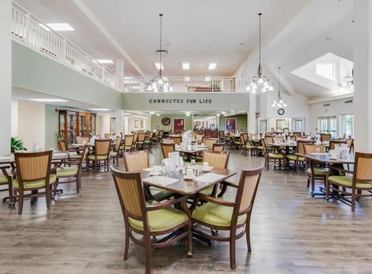 Bright dining room with tables set for meals
