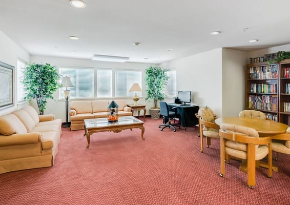Bright common area with seating and bookshelves