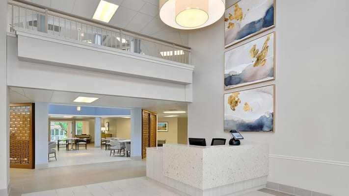 Reception area with modern decor and seating at Summer Place.