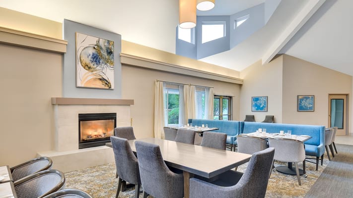 Bright and inviting dining area with a fireplace and modern seating