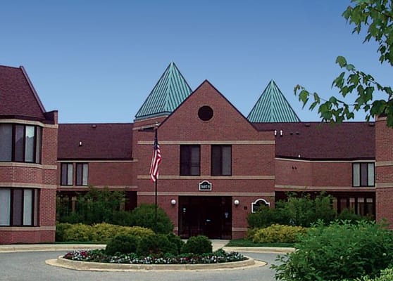 Front view of Holt Heritage Village with landscaped grounds