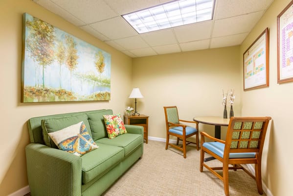 Cozy seating area with a green couch and table