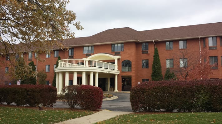 Main entrance of Independence Village with covered porch