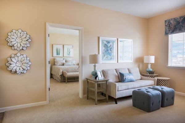 Bright living area with light-colored walls and decorative accents