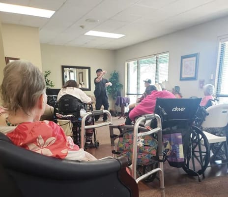 Residents participating in an engaging activity indoors