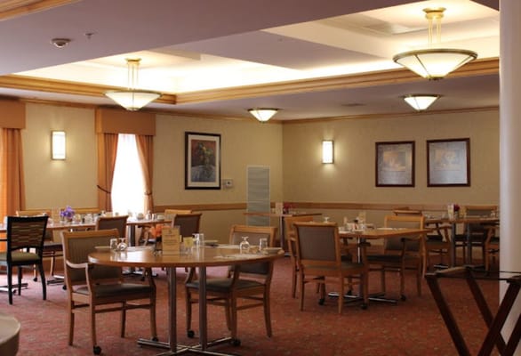 Interior view of a dining room with tables and chairs