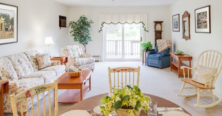 Cozy living room with floral furniture and table set