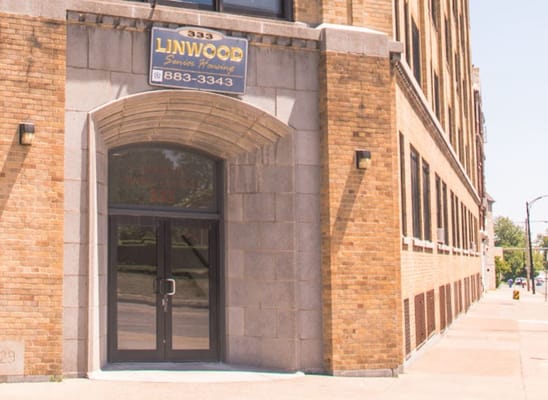 Main entrance of Linwood Elderly Housing with address sign