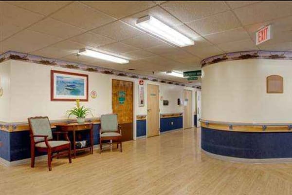 Interior view of a nursing home hallway with decor