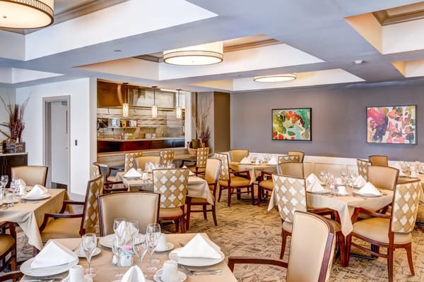 Elegant dining room setup in a senior living facility