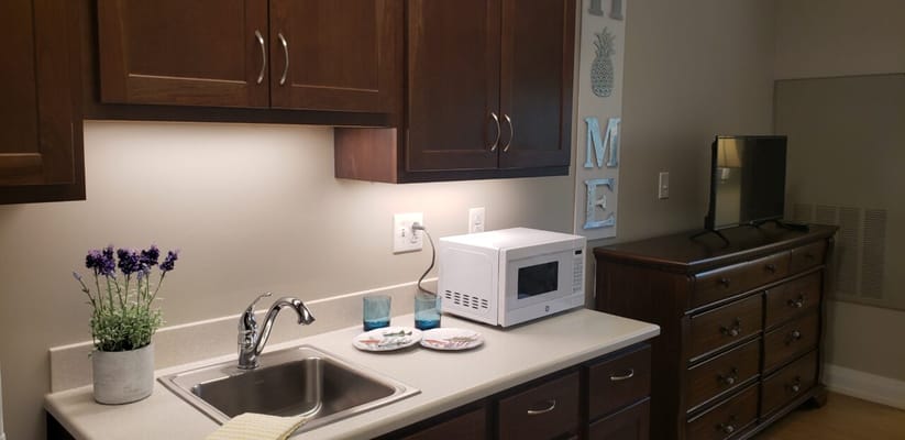 Cozy kitchenette area in a resident suite