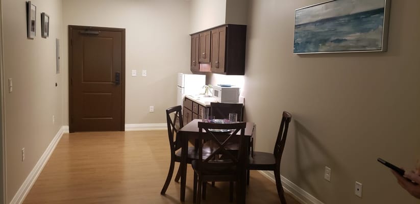 Interior view of a resident living space with kitchenette