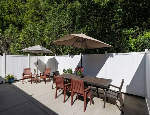 Outdoor patio with seating and umbrellas