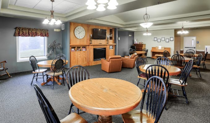 Spacious common area with tables and seating