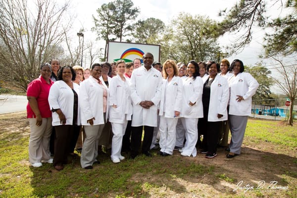 Group photo of nursing staff in white coats at Miracle Hill Nursing & Rehabilitation Center