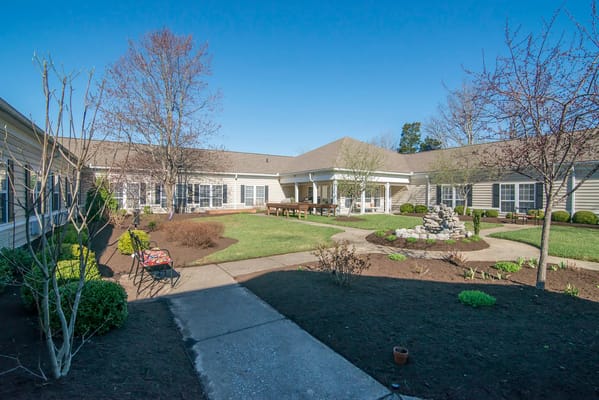 Outdoor courtyard with landscaped gardens and pathways