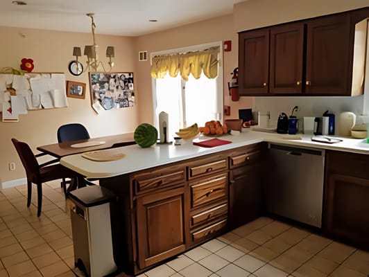 Cozy kitchen area with wooden cabinets and table