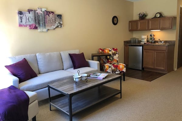 Bright interior of a cozy resident room with furniture