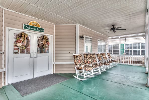 Entrance with rocking chairs and decorated door