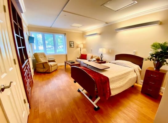 Cozy private room with a bed and seating area