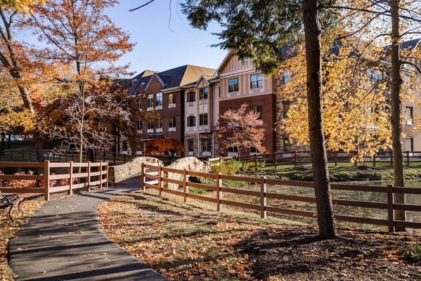 An autumn view of the facility's exterior and pathway