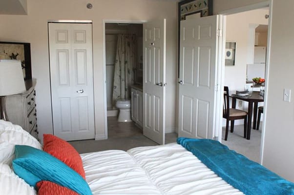 Private resident room with a bed and dining table