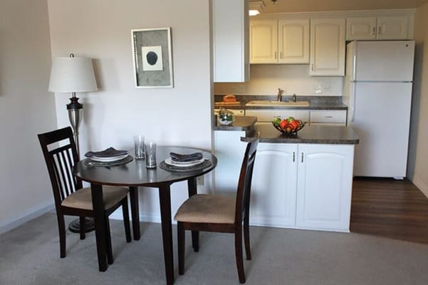Dining area with table and chairs in a bright apartment