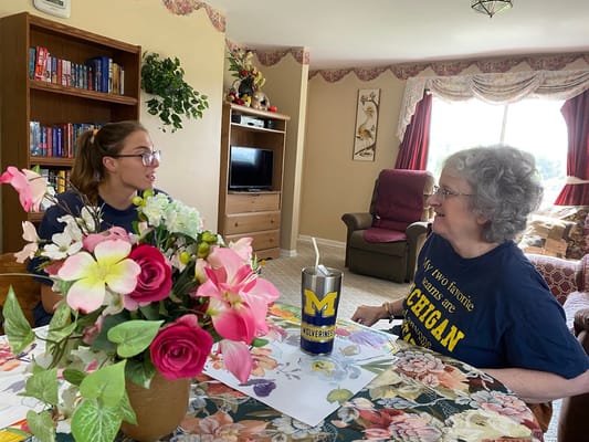 Resident and staff member engaged in conversation