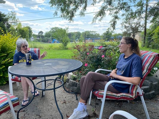 Residents chatting in a garden setting