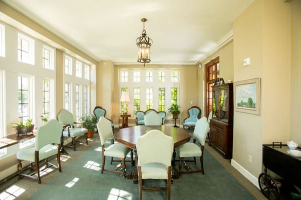 Bright common area with seating and plants