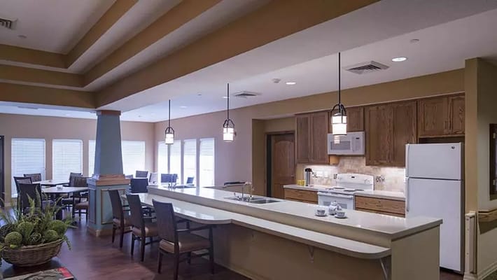 Interior view of a communal area with kitchen and dining space