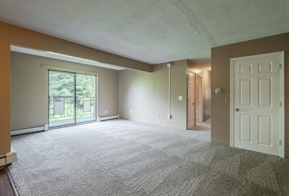 Empty living area with sliding glass doors